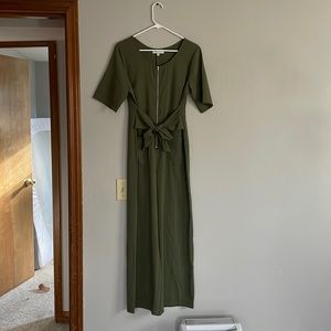 tie waist zip up detail fitting green jump suit. Size S but could fit size M